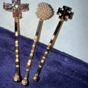 Tory Burch Golden 3 pc.Set Hair Pin Set 
Bobby pins.Never worn w/bag..